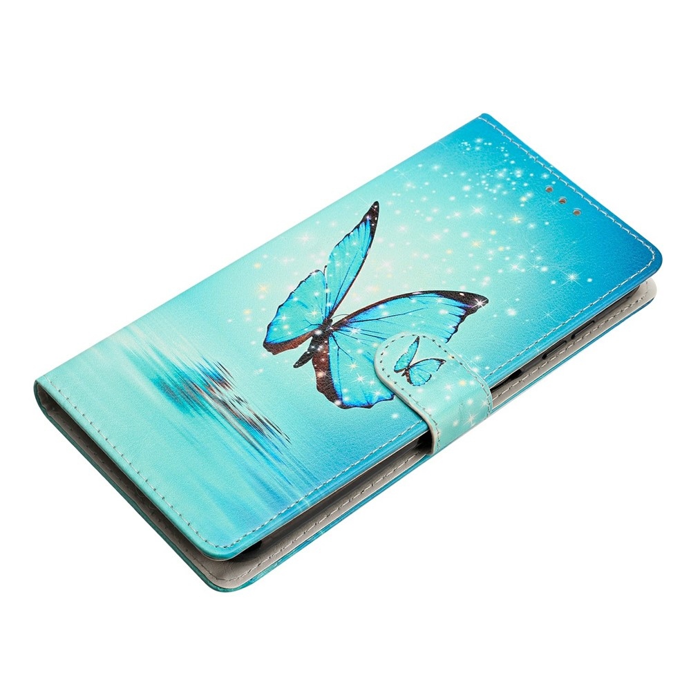 Unique knižkové púzdro na Xiaomi Redmi 17 4G/5G - modrý motýľ